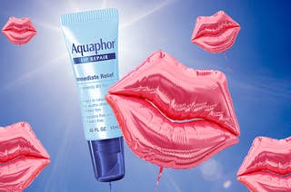 Inflatable baloons in the shape of lips and a tube of Aquaphor float into the sky
