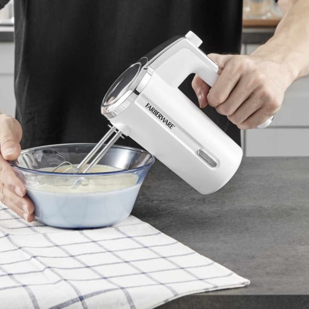 a model using the white wireless mixer in a bowl