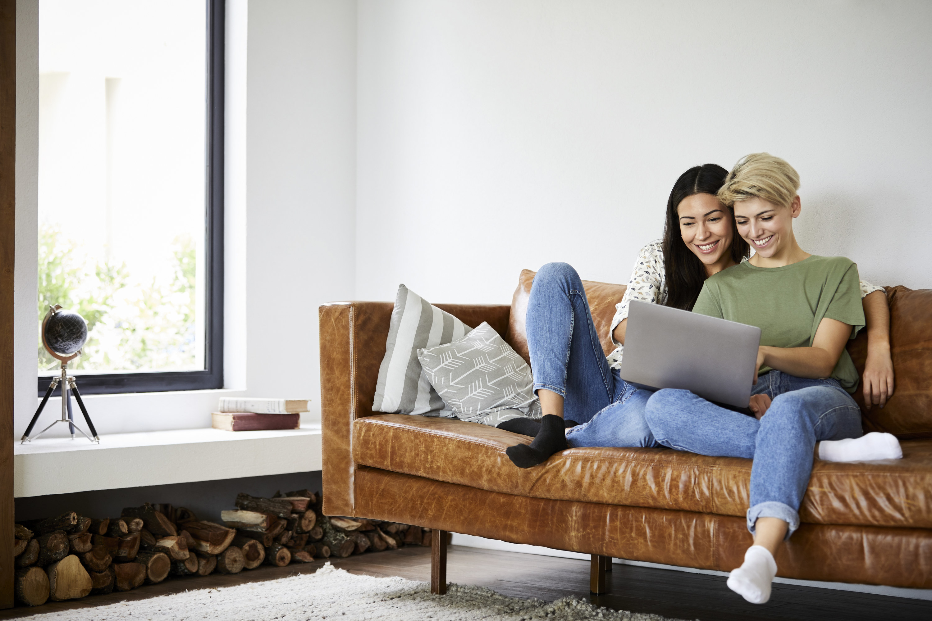 a couple looking at a computer at home