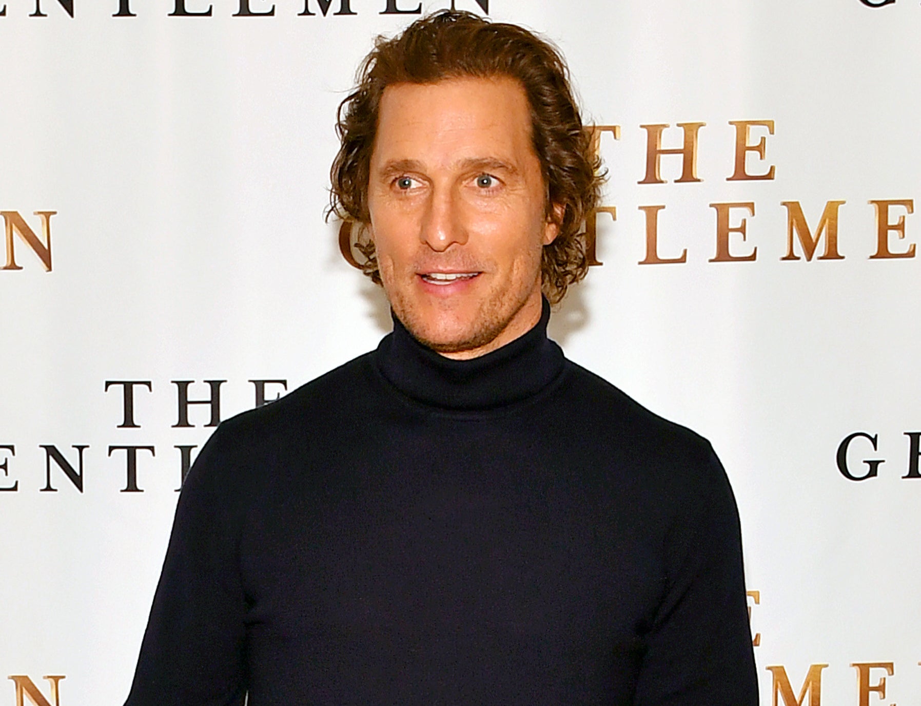 A close-up of Matthew in a turtleneck