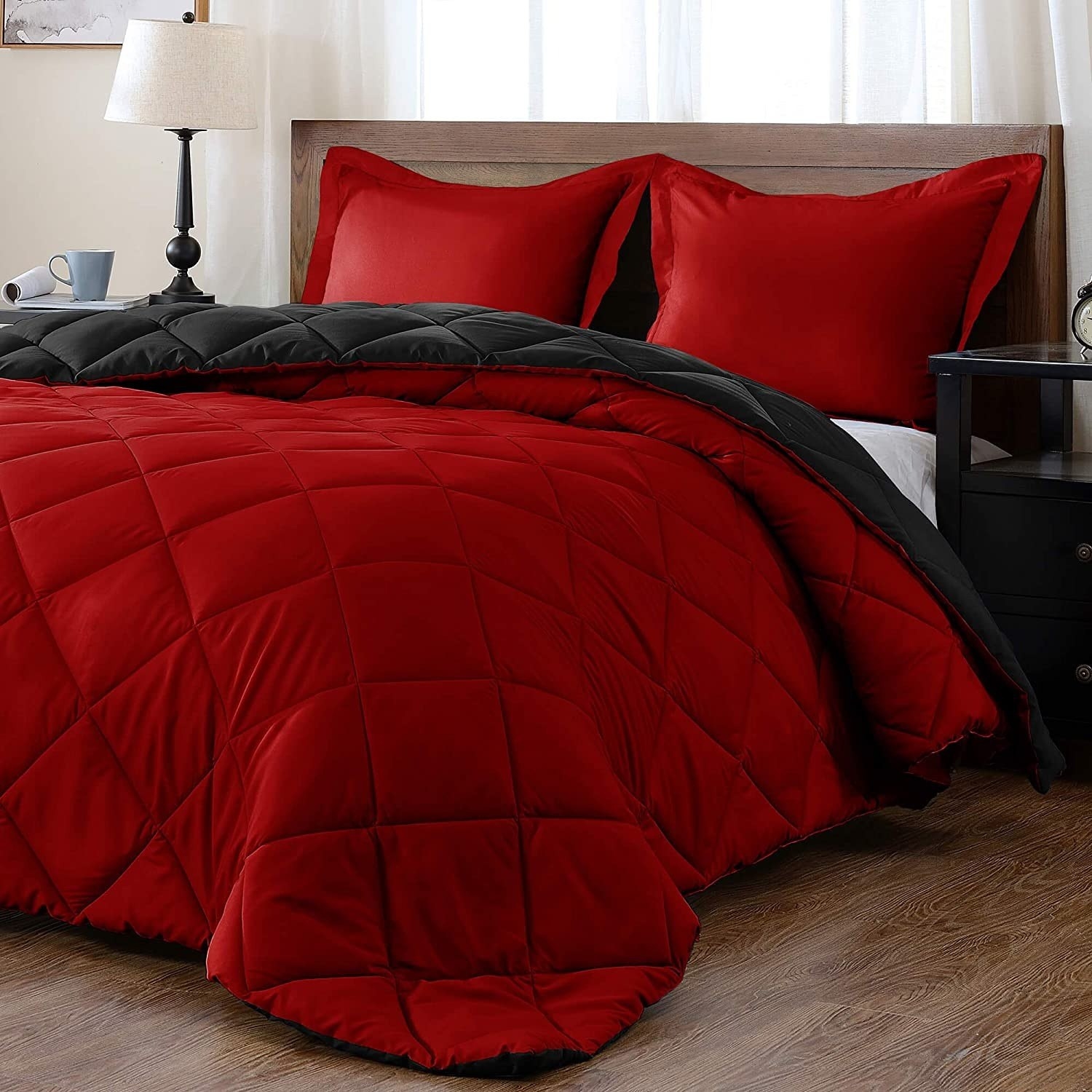the red reversible comforter on a bed