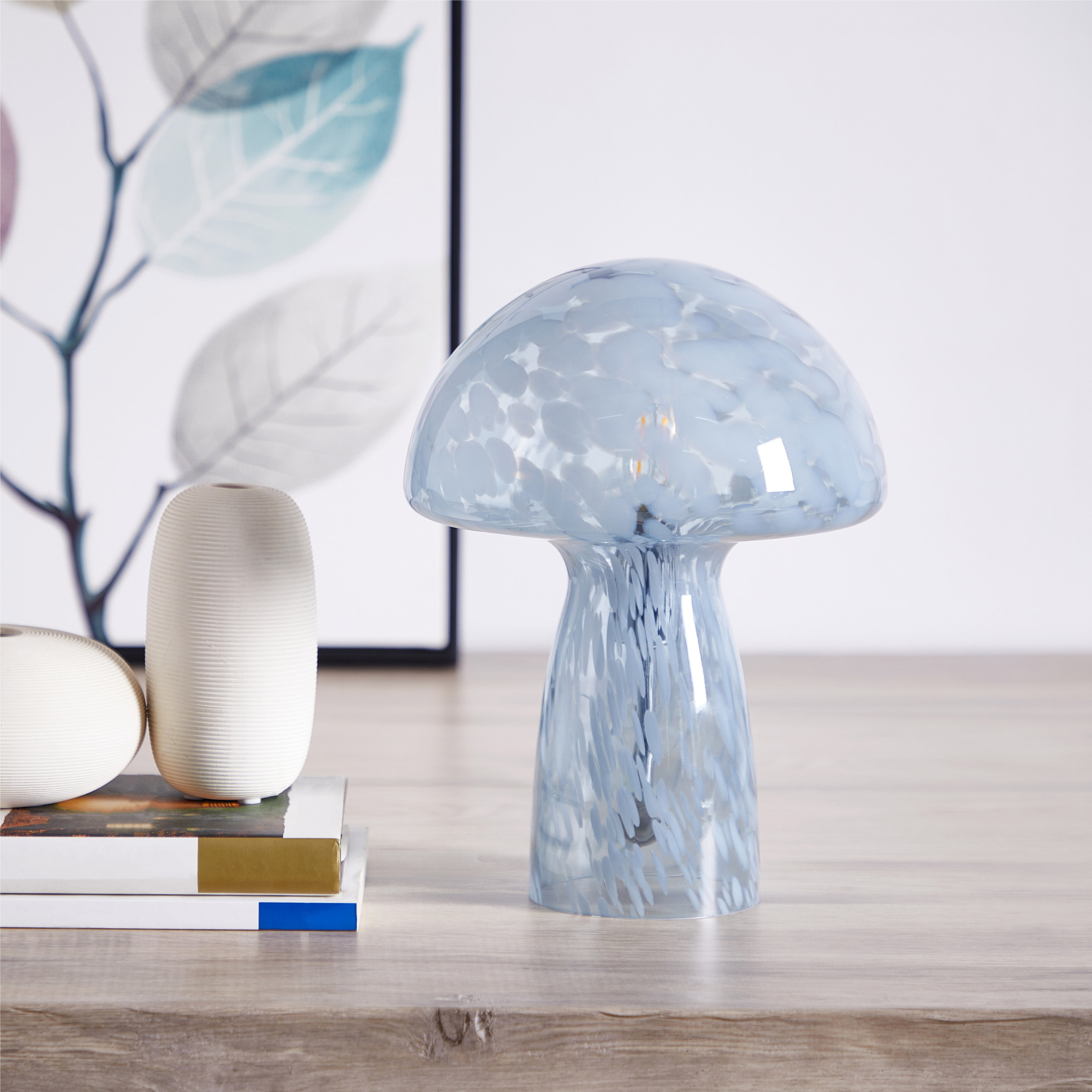 the glass mushroom lamp in a clear blue