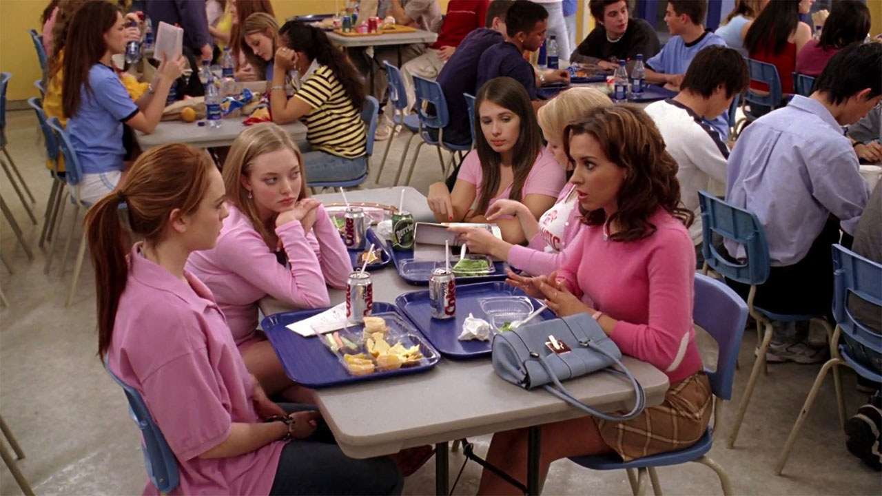The girls from &quot;Mean Girls&quot; sitting in the cafeteria.
