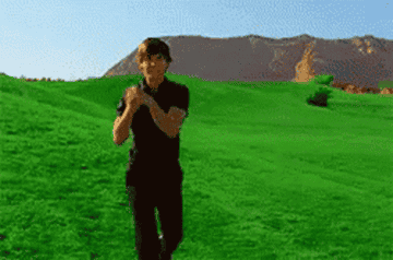 GIF of Zac Efron in a field