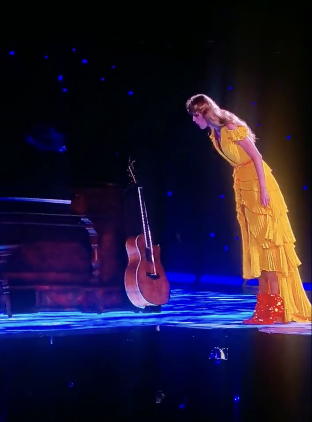 Taylor onstage looking down