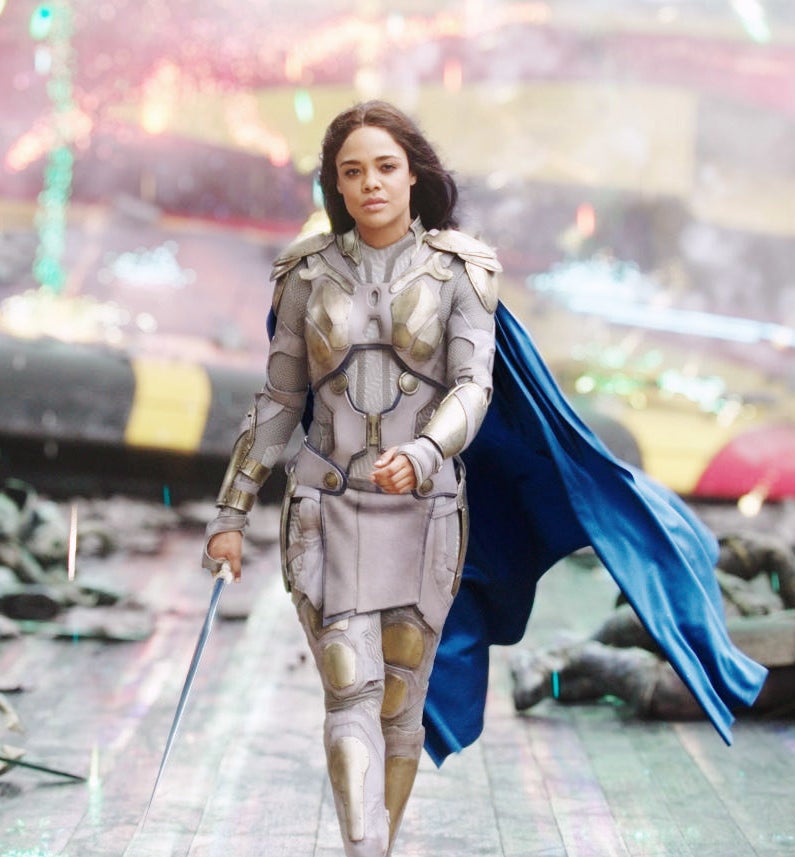 Tessa in character holding a sword
