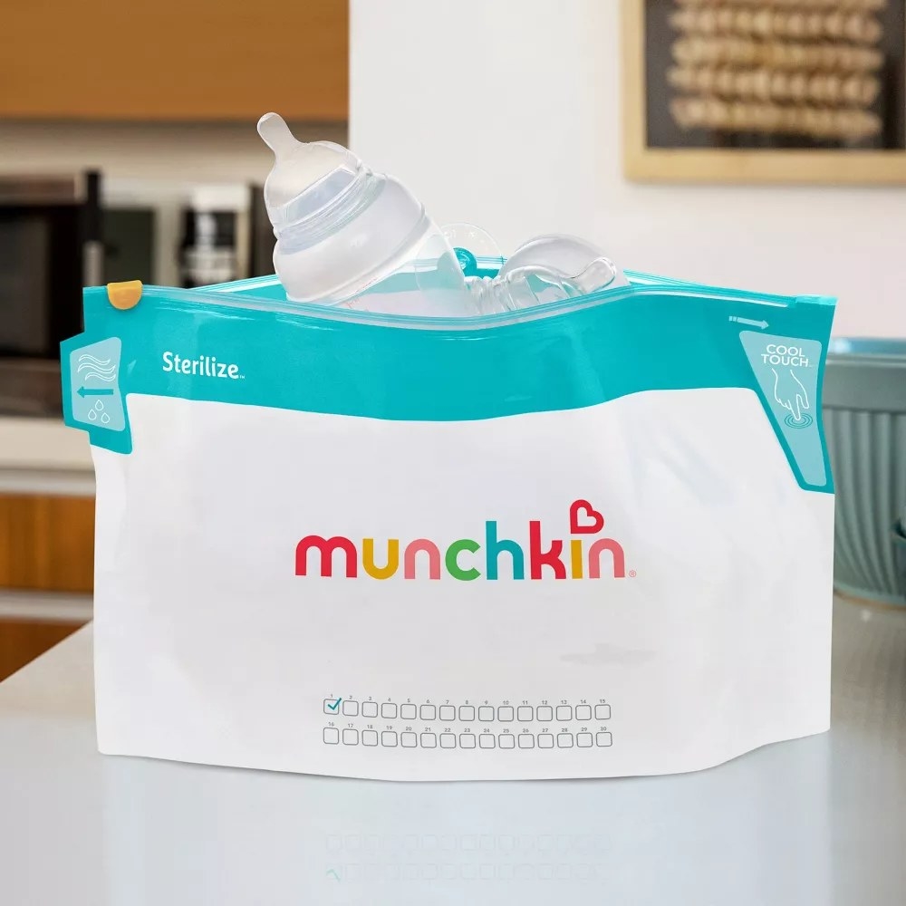 White plastic bag with teal top and brand logo on front and baby bottles inside
