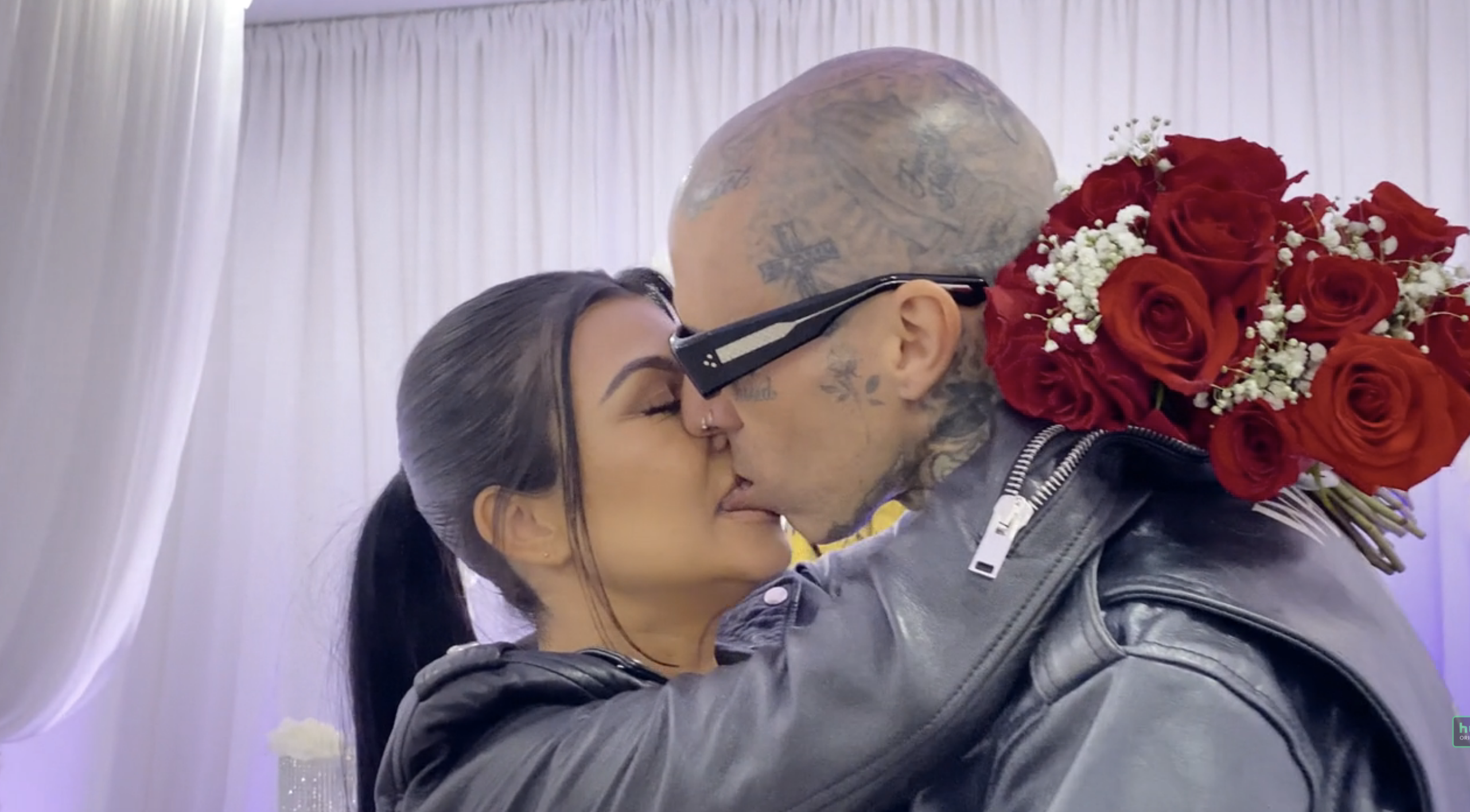 Kourtney and Travis kissing
