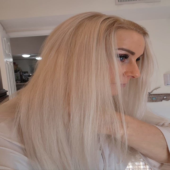 reviewer's hair after using the spray