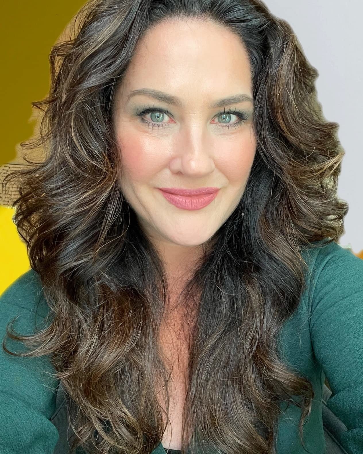 reviewer&#x27;s hair after curling and using the hold spray