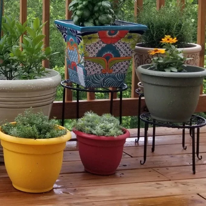 Two of the planters on a wooden patio deck