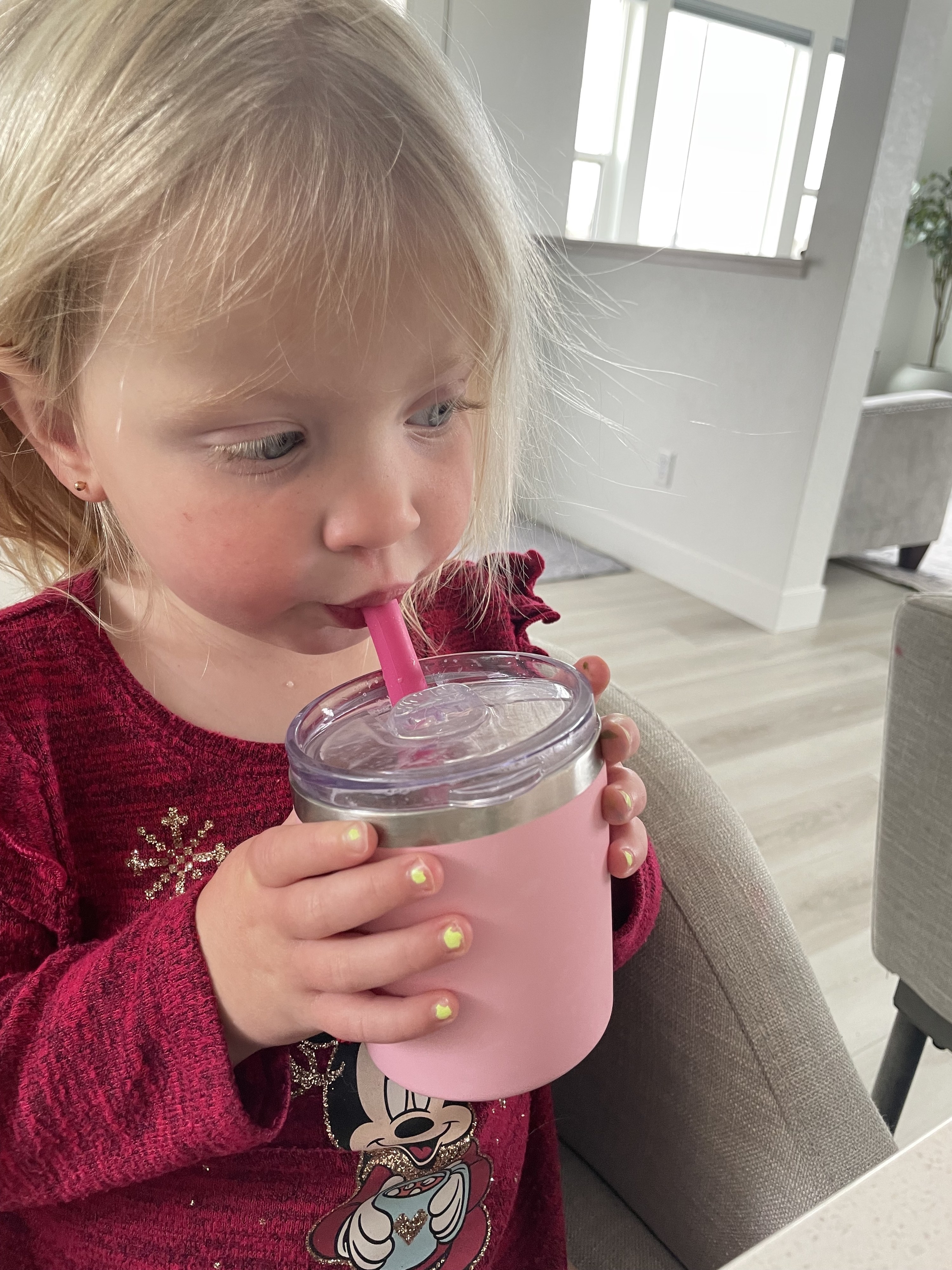 the author&#x27;s daughter drinking a smoothie