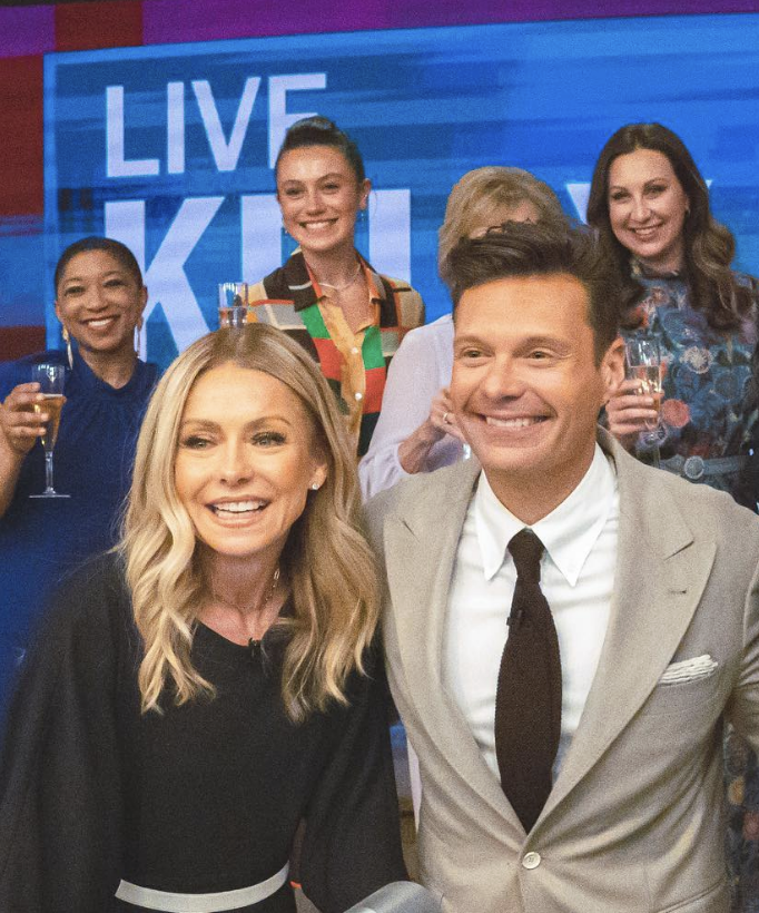 aubrey in the back of the photo behind kelly ripa