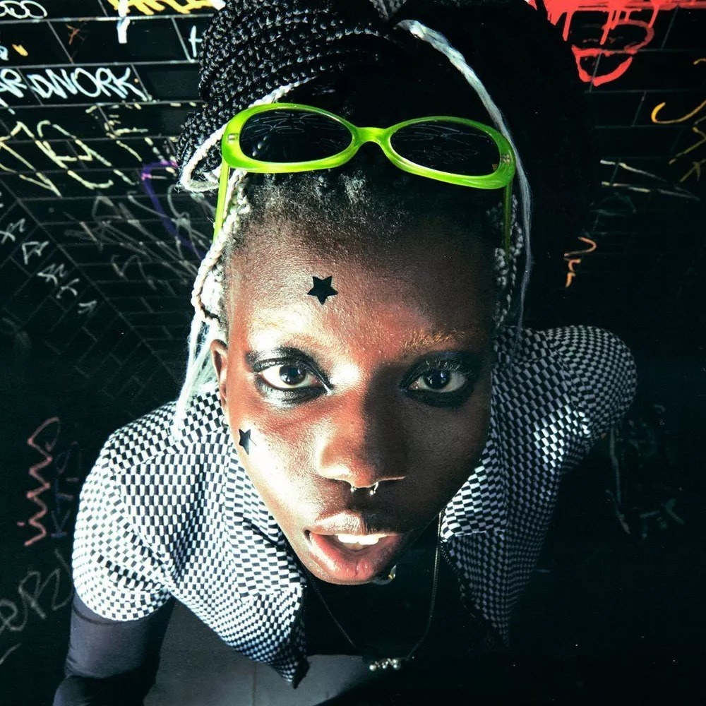a model wearing the black stars on their face