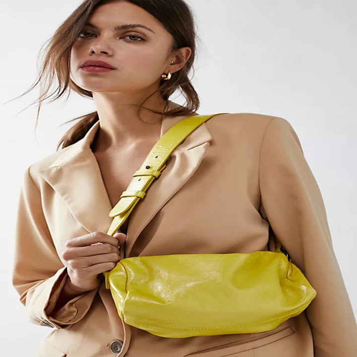 Modeling wearing the limelight green purse