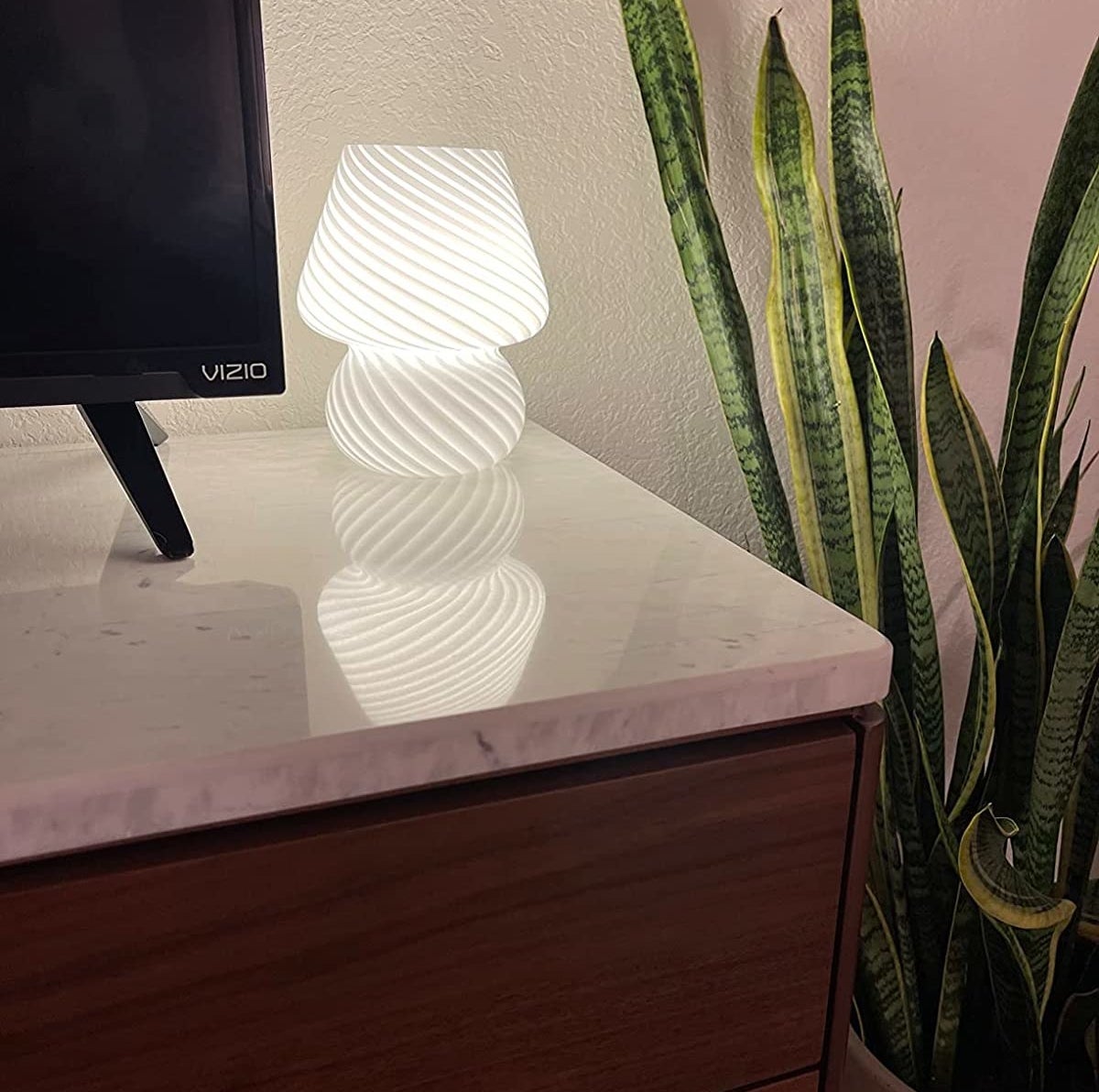 Reviewer&#x27;s lamp in white on a table