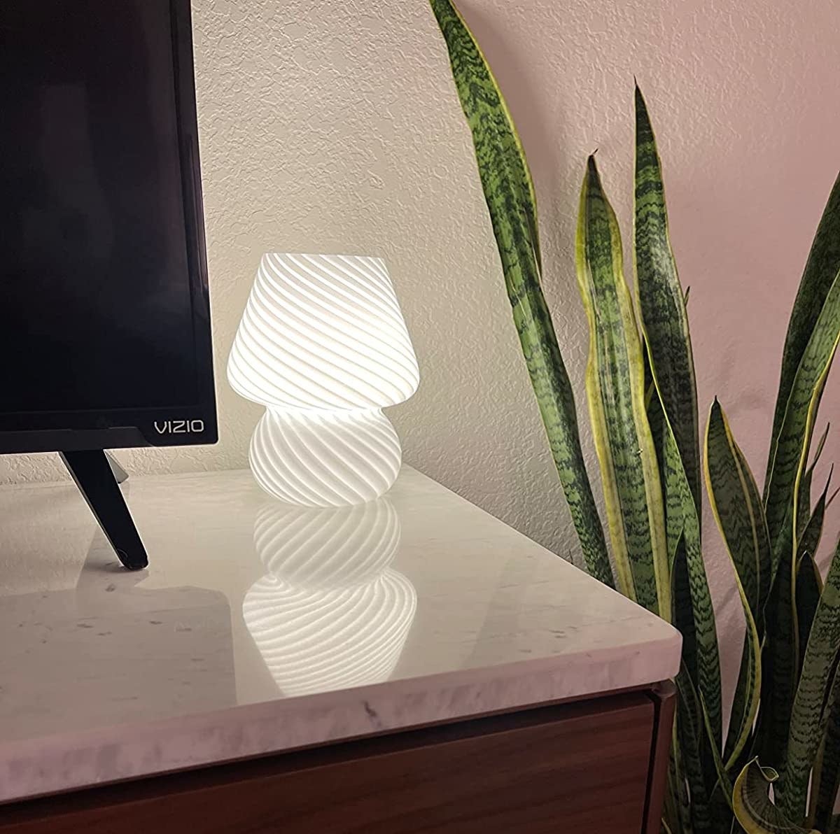 Reviewer&#x27;s lamp in white on a table