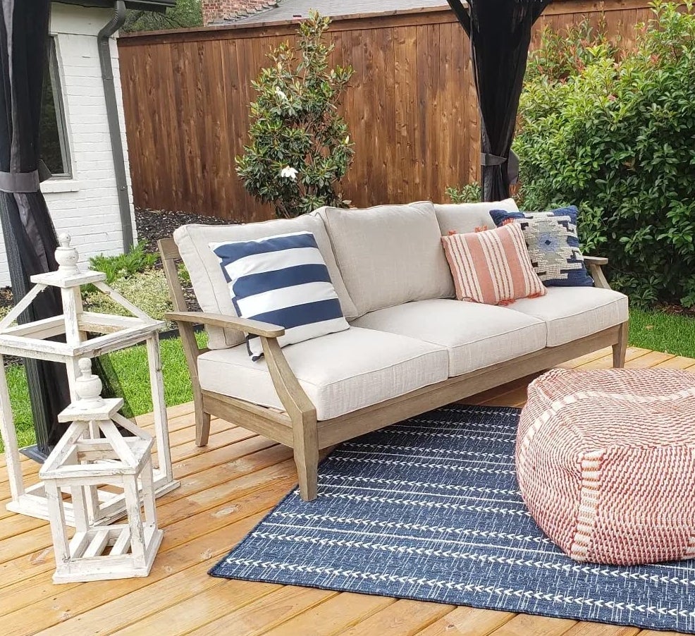 Reviewer's sofa is shown on an outdoor patio