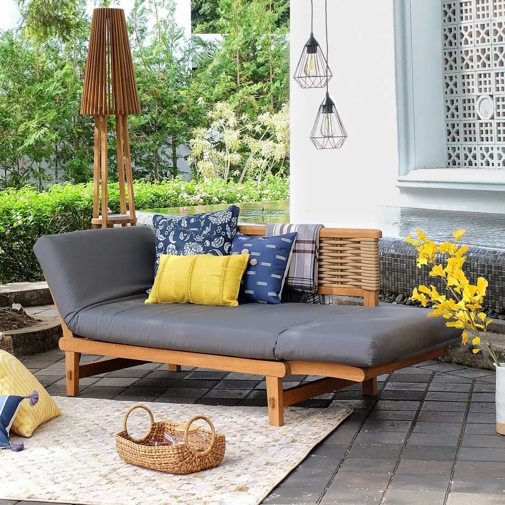 The blue chaise is shown on an outdoor patio