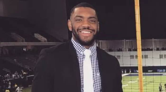 A smiling man in a suit and tie