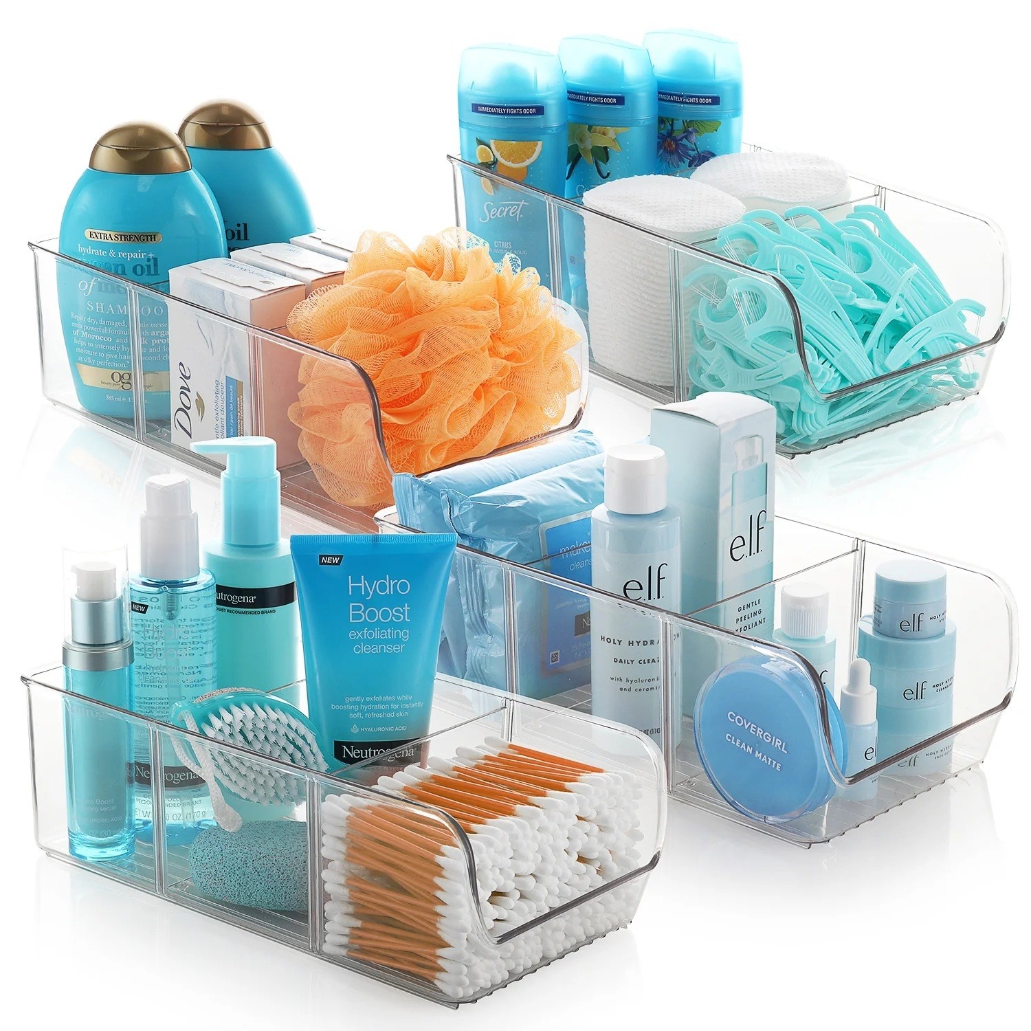 The four clear storage containers with dividers holding deodorant, shampoo, and more