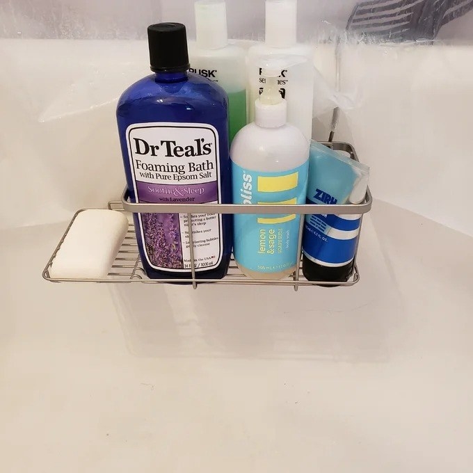 A reviewer photo of the caddy in a bathtub