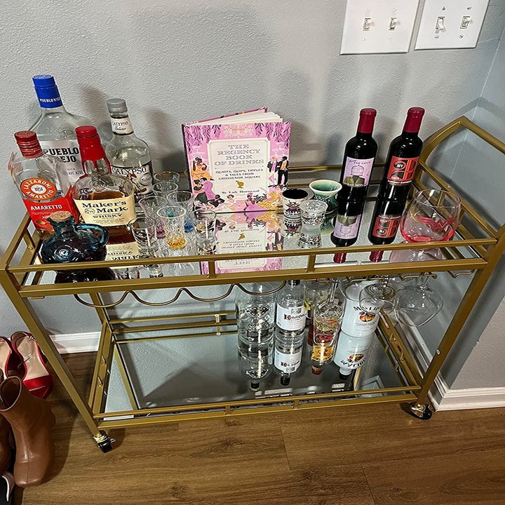 A reviewer's photo of the bar cart stocked with bottles