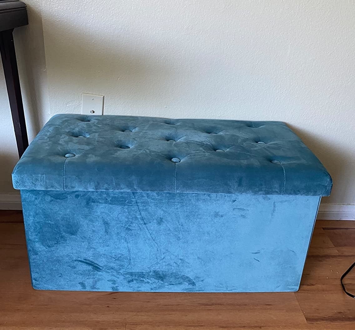 A reviewer&#x27;s photo of the large blue ottoman