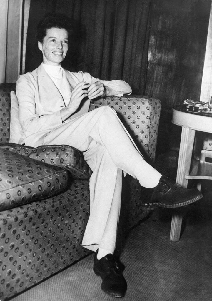 Katharine on a couch in pants