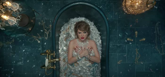 Taylor Swift in a bathtub of diamonds.