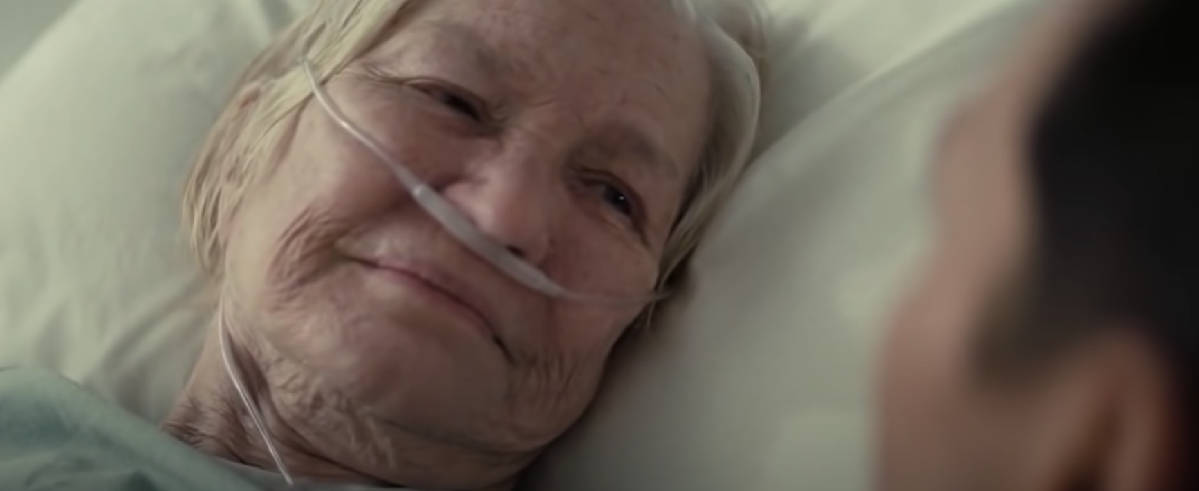 An older woman in a hospital bed