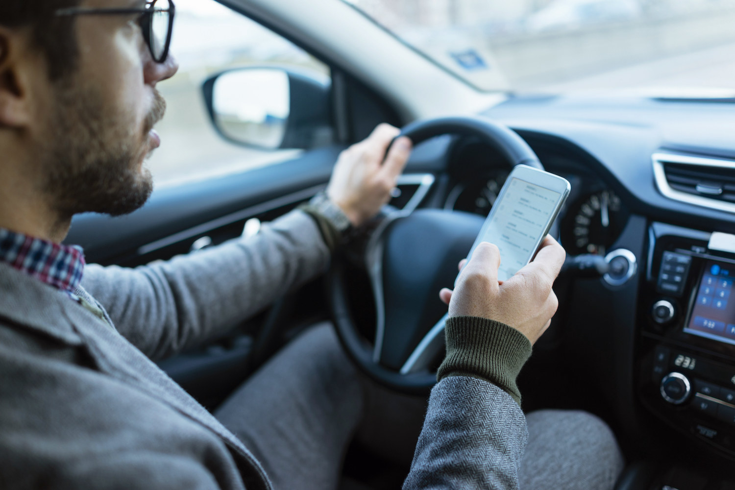 A man texting while driving