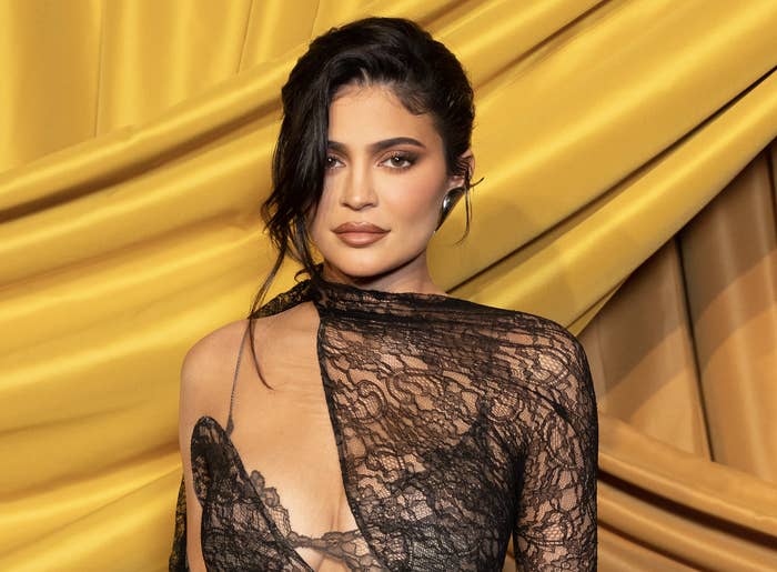 Kylie in a sheer, lace dress