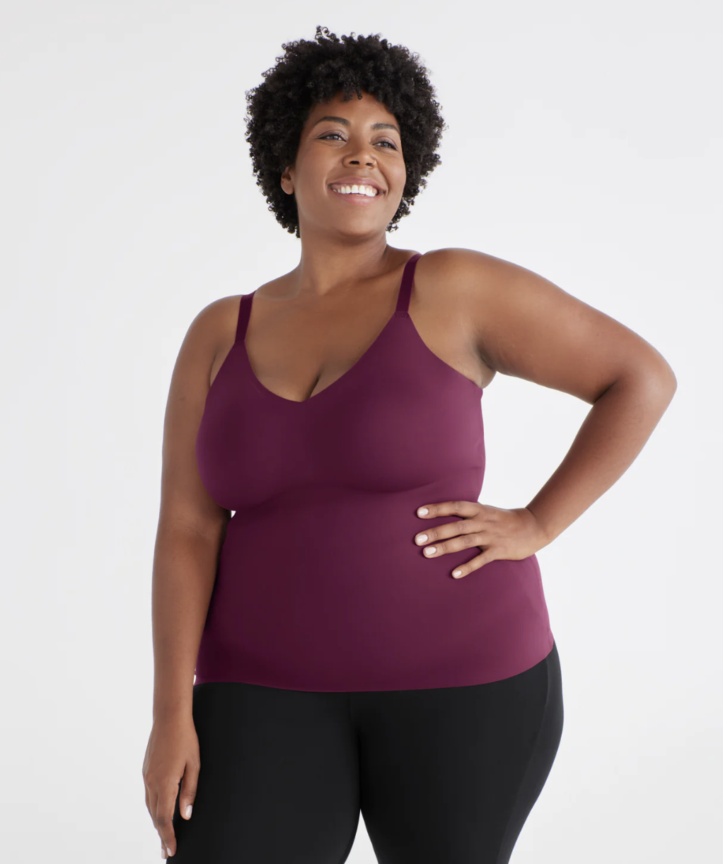 a model wearing the tank top with leggings in front of a plain background