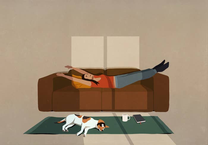 Cartoon of a woman stretching on her couch while her dog lays on the floor