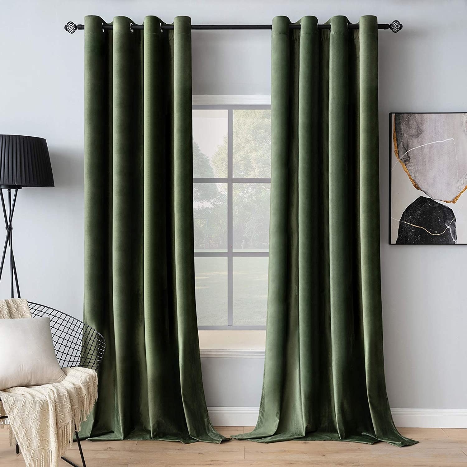 Two blackout curtains slightly covering a living room window
