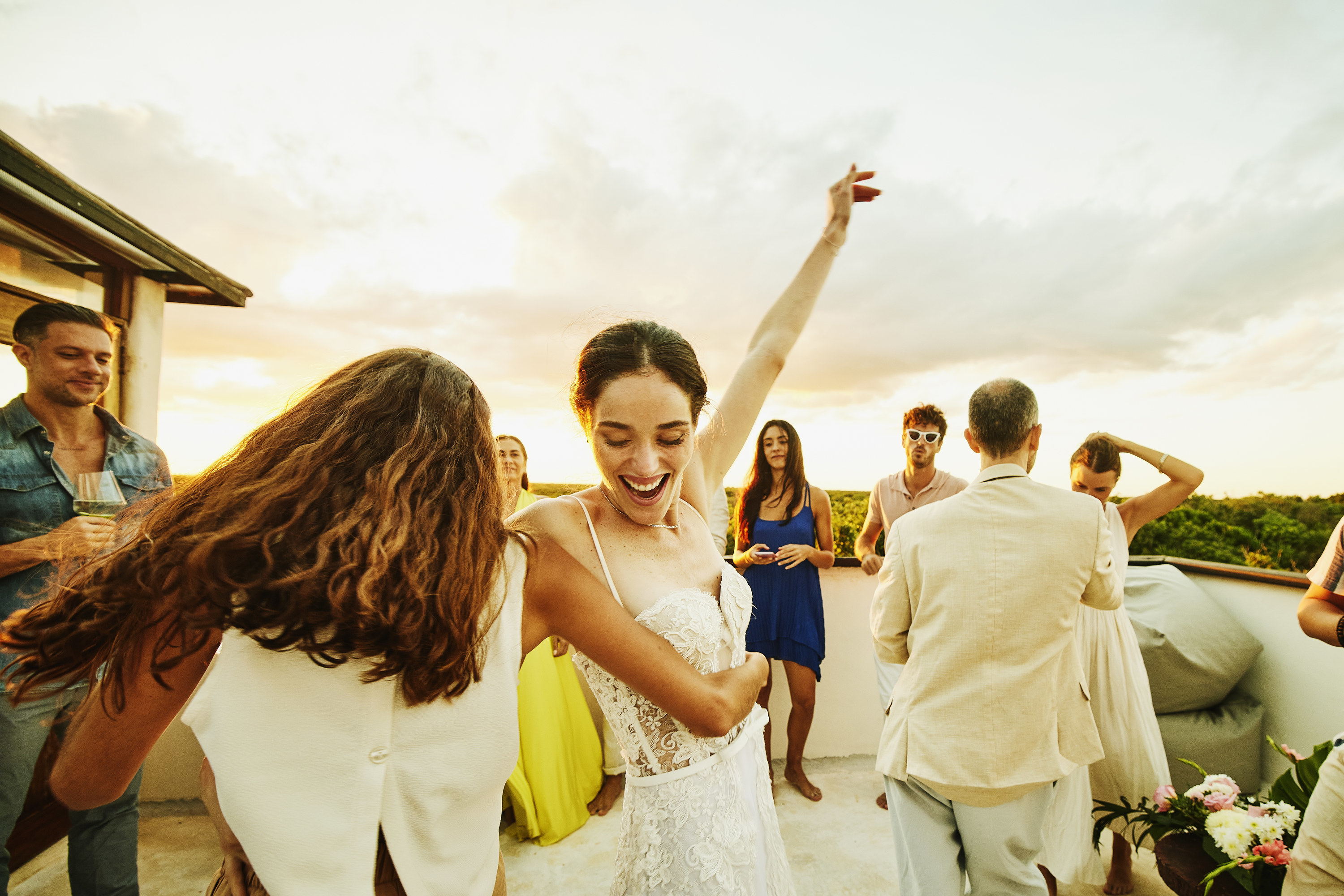bride dancing with friends