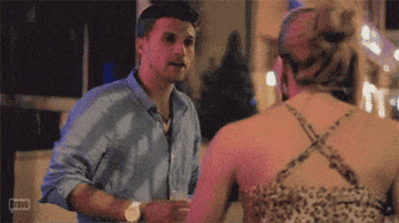 A GIF of Tom Schwartz pouring a drink on Katie Maloney in Mexico