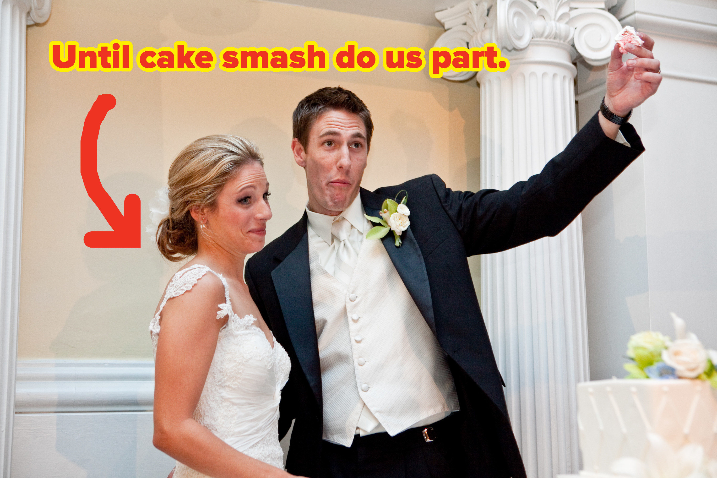 A bride and groom pose with the groom&#x27;s hand poised to smash a piece of cake in the bride&#x27;s grimacing face.