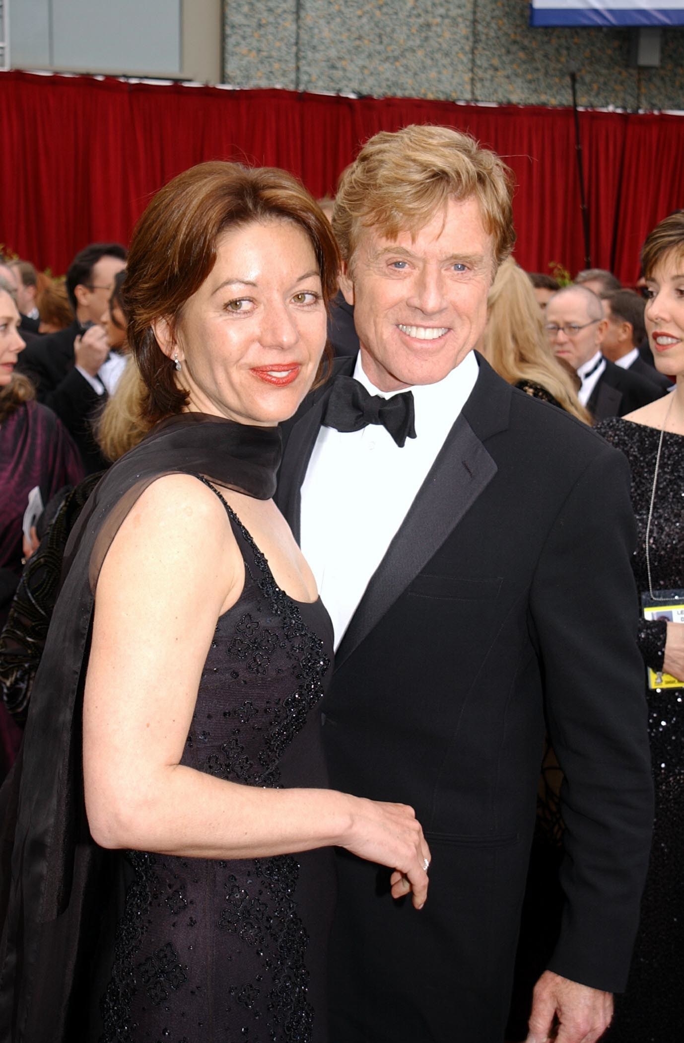 Robert Redford and Sibylle Szaggars standing together on the red carpet