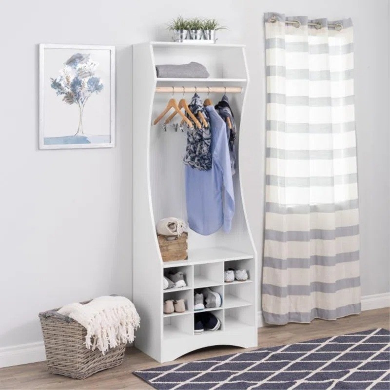 white open armoire with nine shoe cubbies and closet rod for hanging up clothes