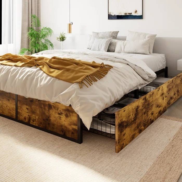 the slide-out bed with wood storage drawers underneath
