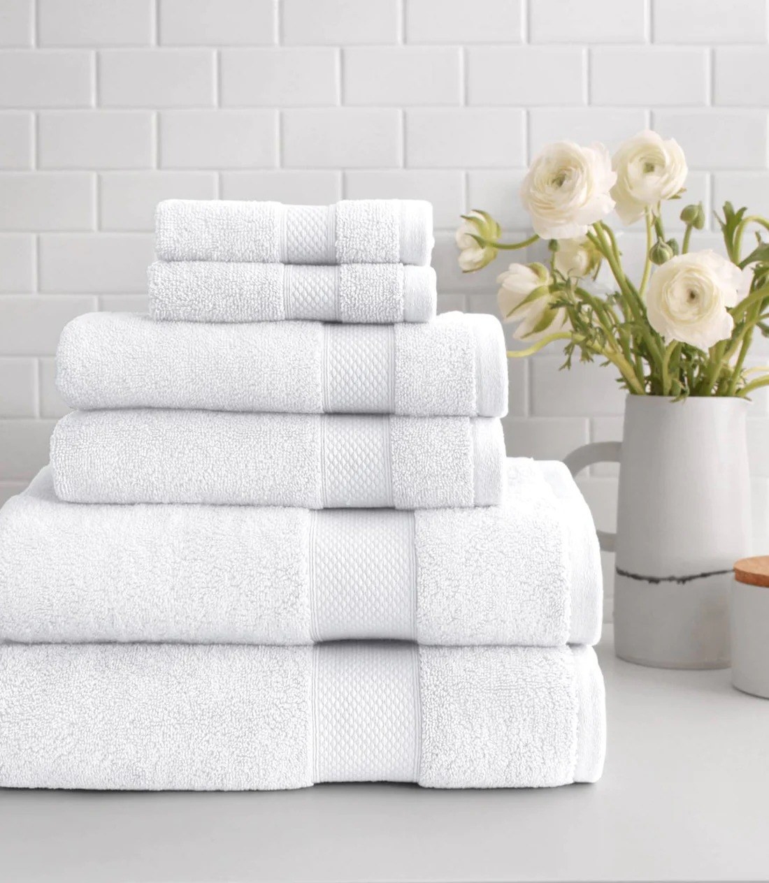 a stack of plush white towels