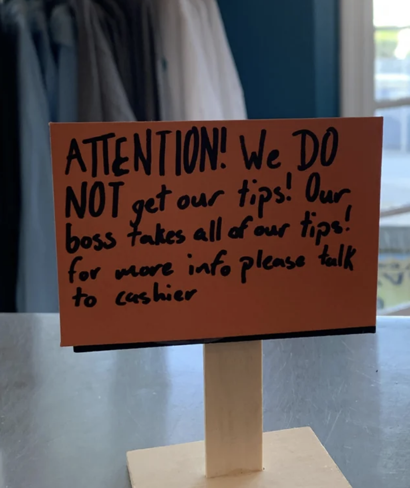 post at the register saying that employees do not see their tips because the boss takes them