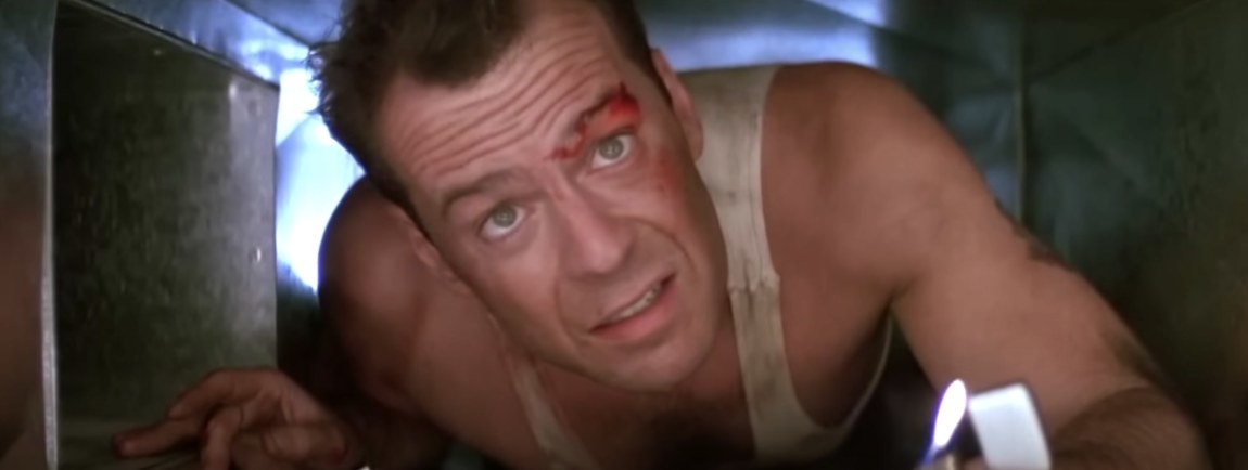 Bloodied Bruce Willis in a shaft