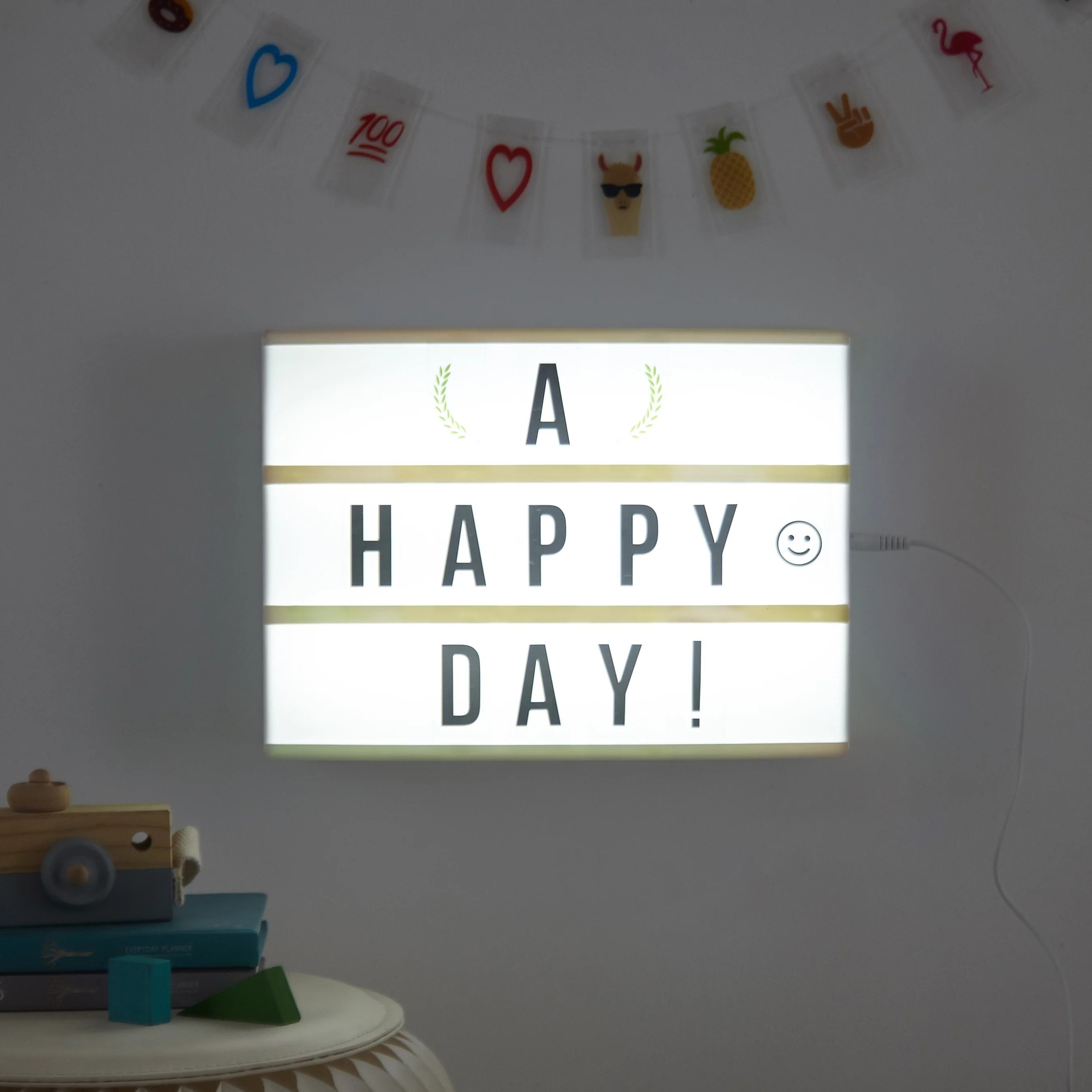 the light up letter board that reads a happy day