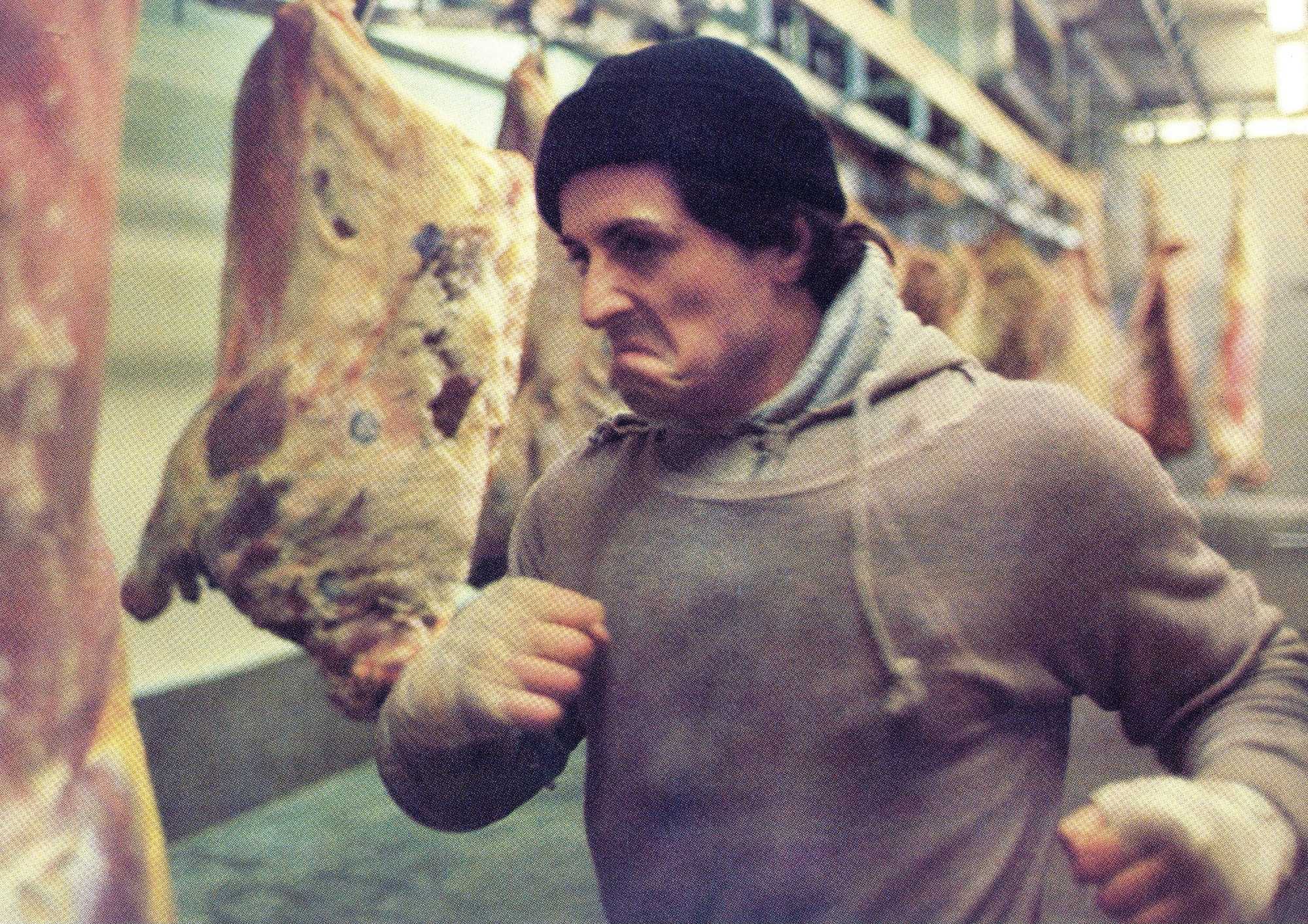 Sylvester Stallone beats up frozen meat in a slaughterhouse