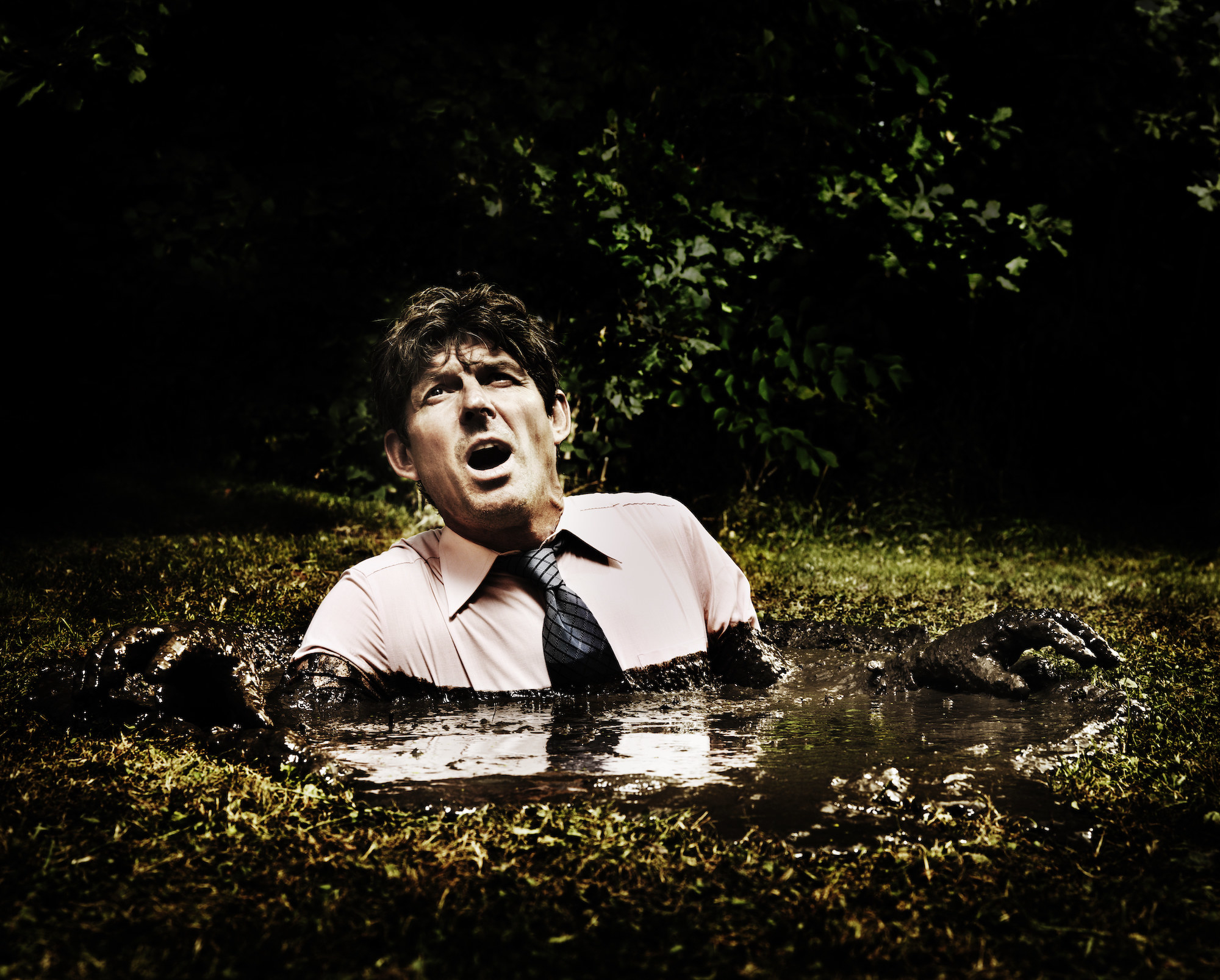 A man sinking in quicksand