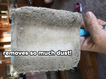 a reviewer's  baseboard cleaning tool's cloth filled with dust
