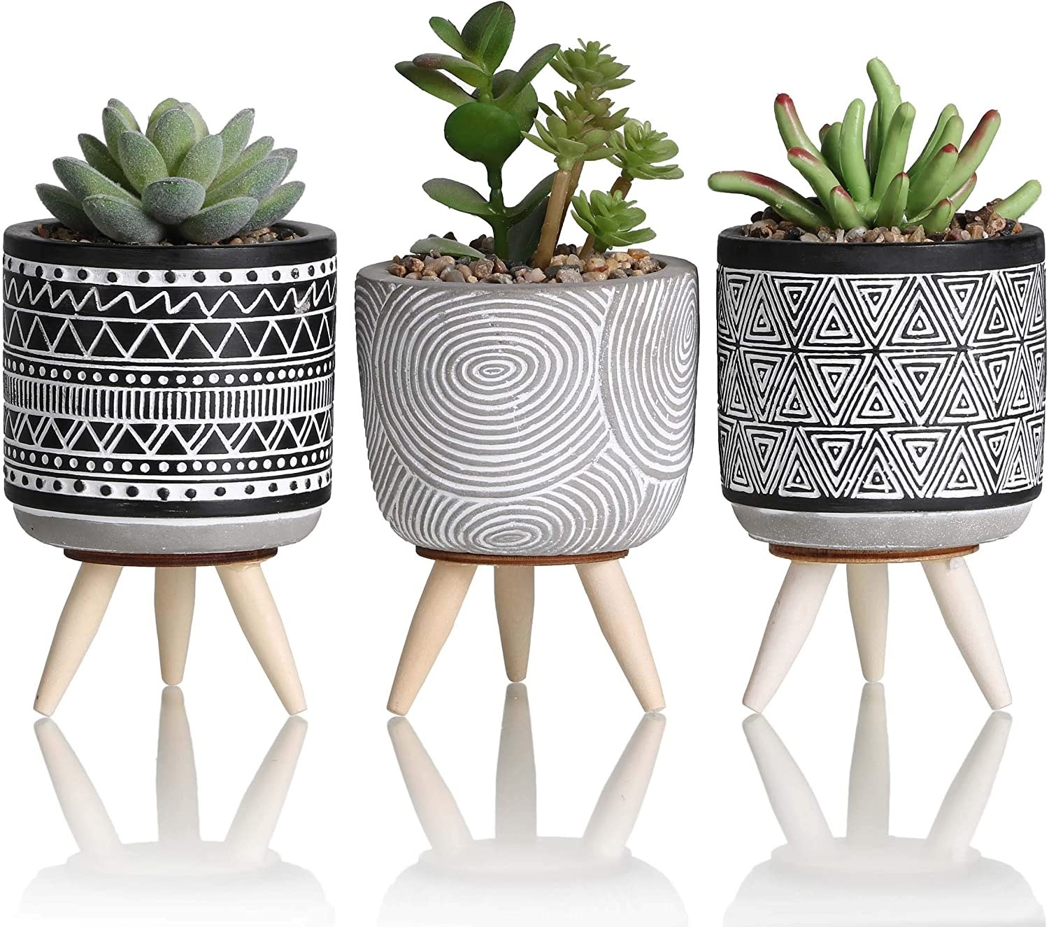 A set of three planters with patterned designs, each holding an artificial succulent plant